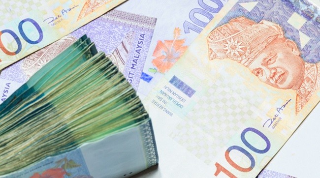 Ringgit lower against US dollar